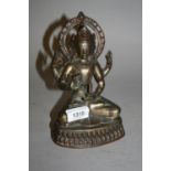 Asian coppered bronze figure of a seated deity, 7ins high