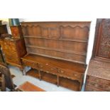 Large reproduction oak dresser, the boarded shelf back with two small panelled doors above three