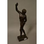 Brown patinated plaster figure, nude male, signed H. Thomas, 1935 (restored)