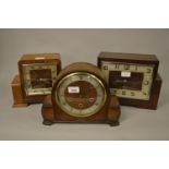 Art Deco walnut three train mantel clock, together with three other mantel clocks