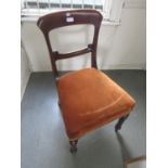 Set of four Victorian mahogany balloon back dining chairs with overstuffed seats raised on turned