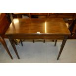 Edwardian rectangular mahogany fold-over card table on square tapering supports and spade feet
