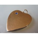 Large 15ct gold heart shaped locket set with a single sapphire