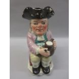 Early 19th Century Staffordshire pottery Toby jug, a seated figure with tankard and clay pipe