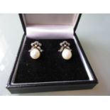 Pair of pearl and diamond bow form drop earrings