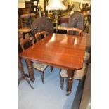 Victorian mahogany rectangular wind-out extending dining table with two extra leaves above a moulded
