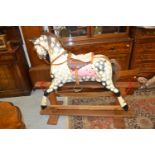 Small early to mid 20th Century painted dapple grey rocking horse with leather harness on a pine