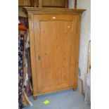 Pair of 19th Century Continental stripped and polished pine wardrobes, each with a moulded cornice