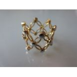 18ct Two colour gold ring of pierced design