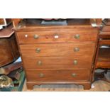 George III mahogany and boxwood line inlaid straight front chest of four graduated drawers with oval