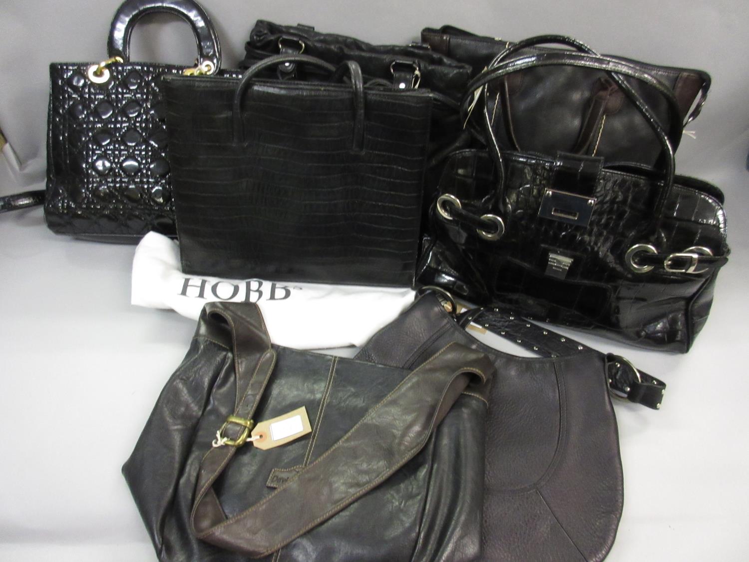 Hobbs black tote bag with dust cover, together with five other large black handbags