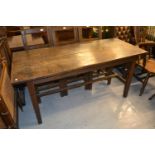 Antique oak farmhouse table, the plank top raised on square tapering supports with H stretcher,