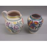 Poole Pottery baluster vase decorated with stylised flowers on a cream ground, together with a