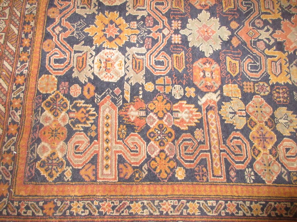 Turkish rug of Caucasian design with an all-over stylised floral and rams head design on a - Image 3 of 5