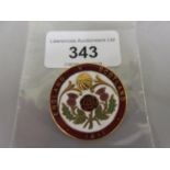 Circular gilt metal and enamel England V Scotland 1911 badge