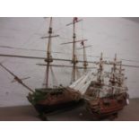 Large scratch built wooden model of a three masted galleon, together with a similar smaller model