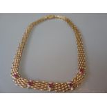 18ct Yellow gold necklet set with cabochon rubies and diamonds