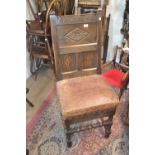 Reproduction oak side chair in 17th Century style with a carved panelled back on turned front