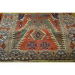 20th Century Kelim rug with all-over geometric pattern on a cream and wine ground, together with
