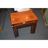 Nest of three 1970's simulated rosewood occasional tables by Heggen of Norway