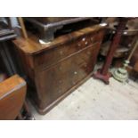 19th Century Continental walnut commode having four drawers with brass circular ring handles on a