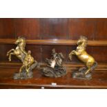 Two brass horse figures together with a patinated composite figure of George and the dragon