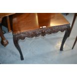 Irish rectangular mahogany table with carved shaped frieze raised on cabriole supports