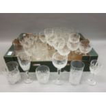 Extensive Waterford crystal suite of drinking glasses of faceted and cross cut design, with