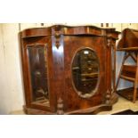 Victorian figured walnut chiffonier with a marble top above three mirrored doors on a plinth base