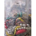 Three large bags containing a quantity of various costume jewellery