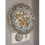 Large 20th Century Dutch floral decorated pottery charger by Royal Tichelaar of Makkum, together