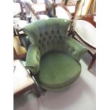 Victorian green velvet upholstered low seat elbow chair on turned ebonised supports, together with