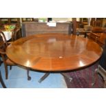 19th Century Jupe type rosewood and mahogany extending dining table, the circular tilt top extending