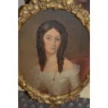 Early 19th century oil on millboard, portrait of a young lady, oval gilt frame