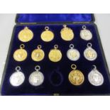 Case containing London Football Association various medals, three 15ct gold, two 9ct gold, two