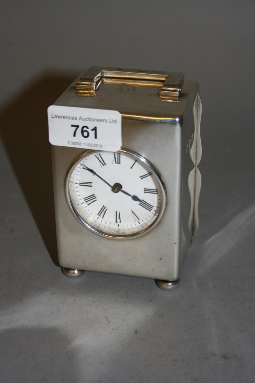 London silver cased carriage clock, the circular enamel dial having Roman numerals with a single