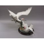 Large Lladro group of two cranes with outstretched wings beside bullrushes, 21ins high, including