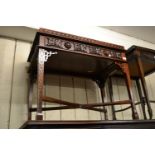 Reproduction mahogany silver table with a galleried top above a long drawer raised on blind