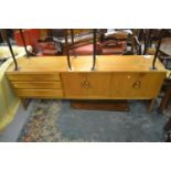 Mid 20th Century teak sideboard by McIntosh, with two pairs of cupboard doors beside a bank of three