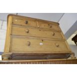 Victorian polished pine straight front chest of two short and two long drawers with knob handles,