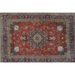 Pair of Tabriz rugs having central medallion with all-over floral design and multiple borders on a