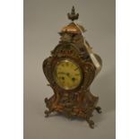 Small late 19th Century French beechwood and figured walnut two train mantel clock with patinated
