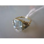 18ct Yellow gold ring set aquamarine with diamond set shoulders