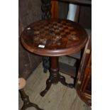 Victorian mahogany and inlaid circular games table with a chequer board inlaid top (damages)