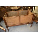 19th Century rectangular mahogany and cane work cot raised on turned tapering supports with brass