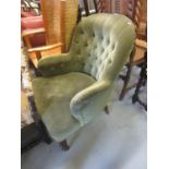 19th Century button upholstered armchair having green upholstery on ring turned supports with