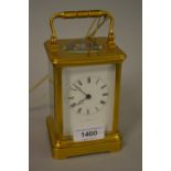 20th Century gilt brass cased carriage clock having repeat function and enamel dial with Roman