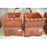 W. Meeds & Son, pair of square terracotta planters having tudor rose decoration, 11ins square each