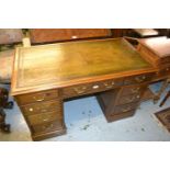 Late Victorian mahogany twin pedestal desk with a green tooled leather inset top above nine drawers,