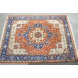 Indo Persian carpet with a medallion and all-over floral design on a rust ground with borders